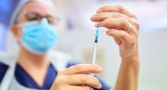 Nurse measuring injection dose