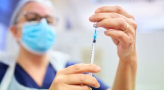 Nurse measuring injection dose