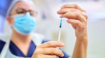 Nurse measuring injection dose