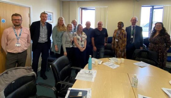 Image of attendees at meeting to discuss reducing harm caused by opioids.