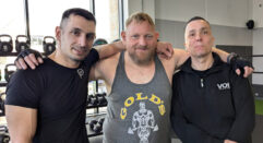 three men together in a gym