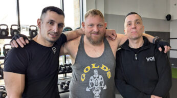 three men together in a gym