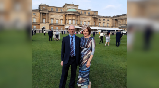 Niki and husband Lee in the gardens of Buckingham Palace